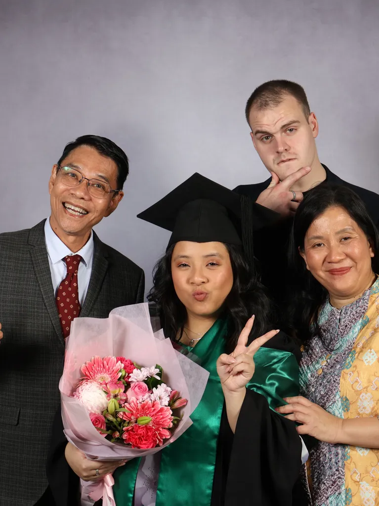 Jasmine, JMC Student with family at graduation 