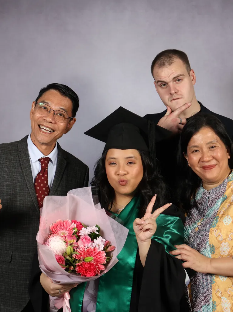 Jasmine, JMC Student with family at graduation